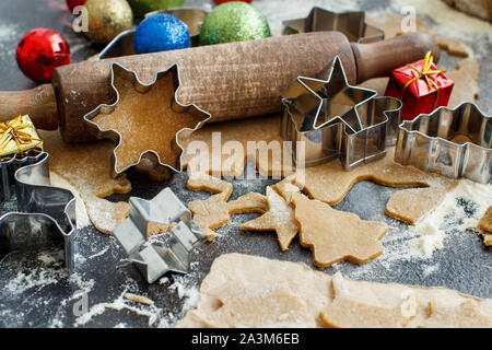 Cooking cookies with  cookie cutters and christmas  decorations Stock Photo