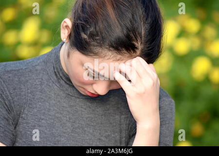Depressed Youthful Asian Person Stock Photo