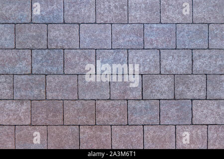 Pattern of square, reddish and bluish paving stones Stock Photo