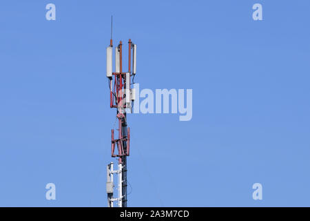 Digital telephone antenna. GSM tower on a blue background. 5g 4g Stock Photo