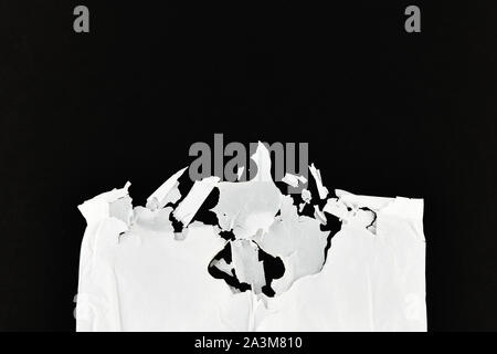 decaying polyethylene. white on a black background. view from above. place for writing. concept of pollution. Stock Photo