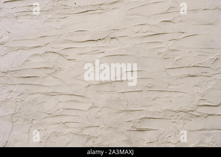 White painted rendered cement external wall of a Cornish cottage. Metaphor blank, whitewashed. Rough whitewashed wall. Stock Photo
