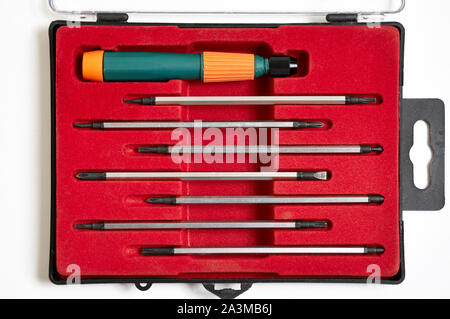 Handle and set of bits for screwdriver. Metal bits for screwdriver. Tool set for household use. Nozzles and adapters for screwdrivers. Head different Stock Photo