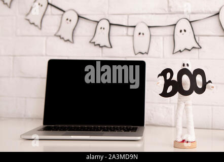 Modern laptop with blank screen on office table Stock Photo