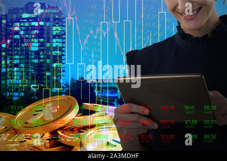 Composite image of smiling business woman using tablet Stock Photo