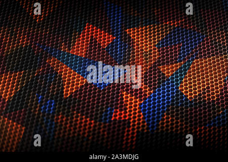 Perforated sheet metal texture with abstract colourful geometric background. Stock Photo