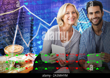 Composite image of smiling business people looking at camera Stock Photo