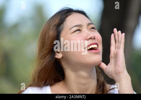 An Asian Female Singing Stock Photo