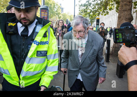 London, UK. 9 October, 2019. John Lynes, a 91-year-old climate activist from Extinction Rebellion is arrested by police officers using Section 14 of the Public Order Act 1986 after blocking Whitehall on the third day of International Rebellion protests to demand a government declaration of a climate and ecological emergency, a commitment to halting biodiversity loss and net zero carbon emissions by 2025 and for the government to create and be led by the decisions of a Citizens’ Assembly on climate and ecological justice. Credit: Mark Kerrison/Alamy Live News