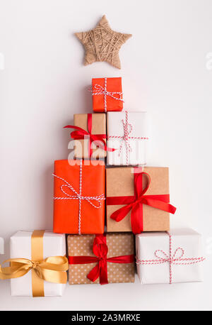 Alternative Christmas tree made of colored present boxes Stock Photo
