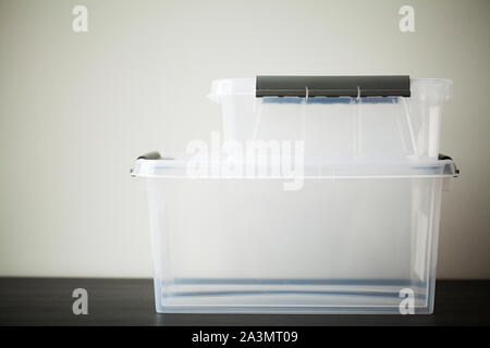 Transparent drawers for storing things on a wooden table Stock Photo