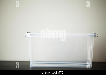Transparent drawers for storing things on a wooden table Stock Photo
