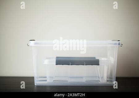 Transparent drawers for storing things on a wooden table Stock Photo