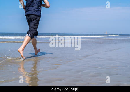 Jogging on the beach Stock Photo