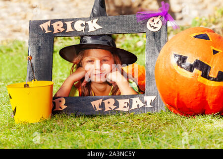 Little girl in trick or treat Halloween frame Stock Photo