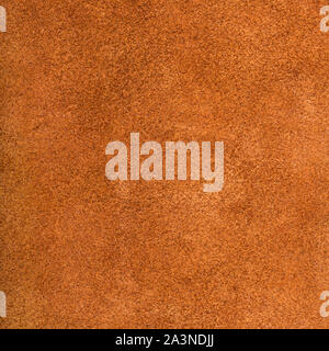 textured square background from dark orange suede close up Stock Photo