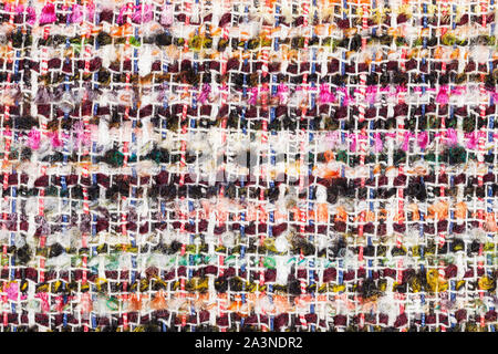 textile background - varicoloured woven yarns of boucle fabric close up Stock Photo