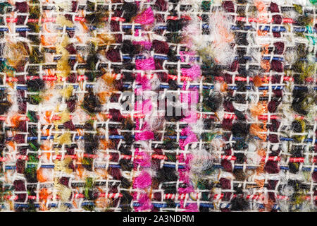 textile background - interlacing of color threads in boucle fabric close up Stock Photo