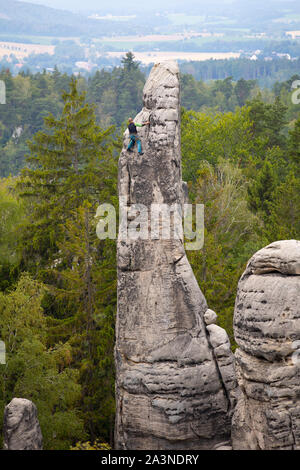 mountain climber at the top,climbing, Prachovske skaly, Czech Republic, A unique combination of outlandish rock formations Stock Photo