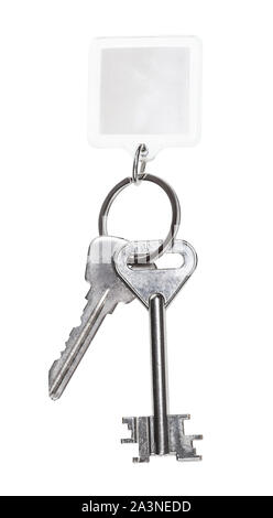 steel keys on keyring with blank keychain isolated on white background Stock Photo