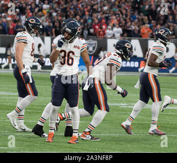 November 21, 2021: Chicago, Illinois, U.S. - Bears #36 DeAndre  Houston-Carson tackles Ravens #89 Mark Andrews during the NFL Game between  the Baltimore Ravens and Chicago Bears at Soldier Field in Chicago