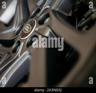 Minsk, Belarus - September 24, 2019: Close up of Land Rover logo on dark colored aluminum rim. Stock Photo