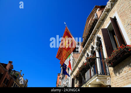 Flag of  Venice in venetian building. Stock Photo