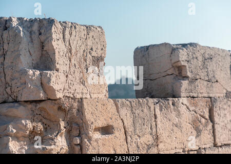 Old deteriorating rectangular stones on a building site. Stock Photo