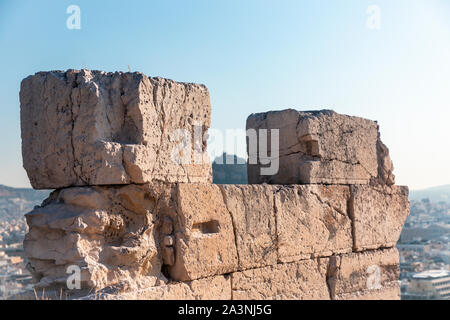 Old deteriorating rectangular stones on a building site. Stock Photo