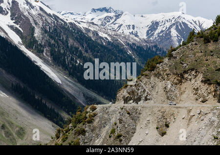 Vehicles making their way up the dangerous Zoji La Pass, Srinagar - Leh National Highway, Jammu and Kashmir, India Stock Photo