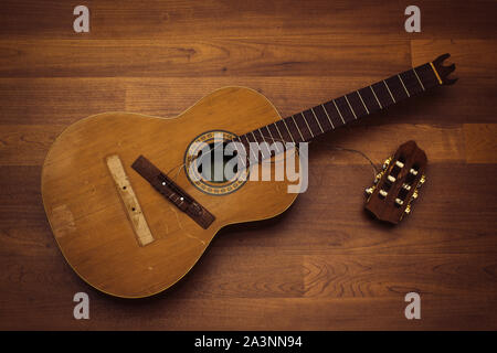 Classical nylon string guitar with broken off headstock and bridge Stock Photo