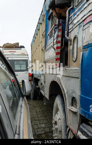 Traffic jams and extremely close crossing of trucks and vehicles due to haphazard parking at Zero Point, Srinagar - Leh Highway, Jammu and Kashmir Stock Photo