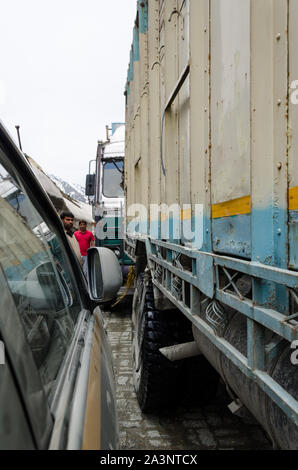 Traffic jams and extremely close crossing of trucks and vehicles due to haphazard parking at Zero Point, Srinagar - Leh Highway, Jammu and Kashmir Stock Photo