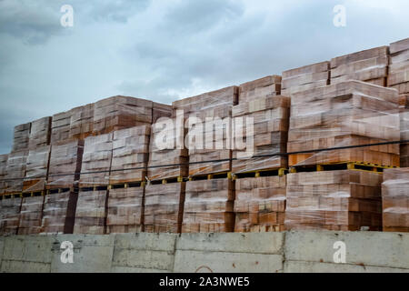 Warehouse of hollow ceramic bricks. Construction base. Stock Photo