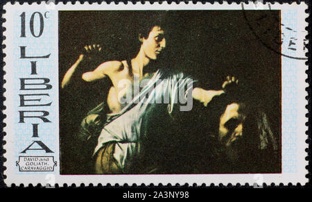 David and Goliath by Caravaggio on postage stamp Stock Photo