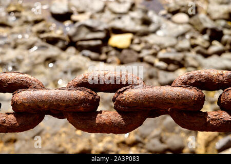 Heavy rust on the links of a chain in Playa Blanca Lanzarote Stock Photo