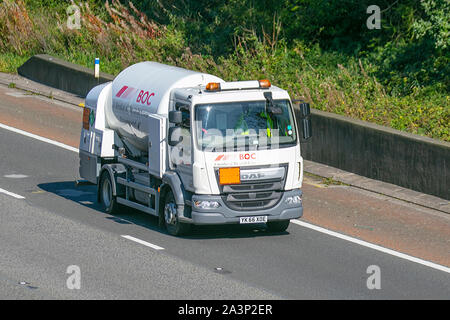 British Oxygen Company BOC liquid gas material. Industrial gases; heavy bulk haulage delivery trucks, hazardous canisters, lorry trailer, transportation, truck, dangerous cargo, DAF vehicle, delivery, transport industry freight on the M6 at Lancaster, UK Stock Photo