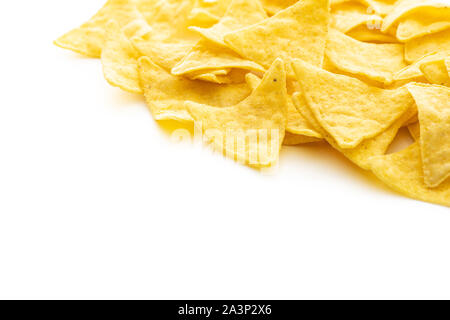 Corn nacho chips. Yellow tortilla chips isolated on white background. Stock Photo