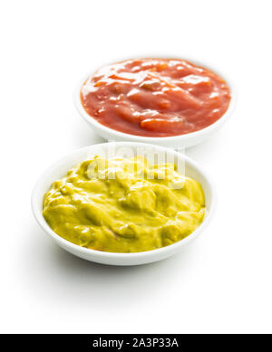 Sauces in bowl. Guacamole and tomato dip isolated on white background. Stock Photo