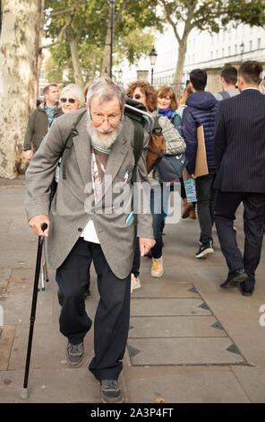 London, UK. 9th October 2019. Veteran protester, and Extinction Rebellion oldest British activist John Lynes, 91 of St Leonards-on-sea, East Sussex, here seen in Whitehall, Westminster, before his arrest. Credit: Joe Kuis / Alamy News