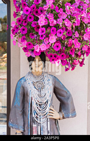 A mannequin of a Native American woman to attract tourists at a shop along 4th Avenue in downtown Anchorage, Alaska. Stock Photo