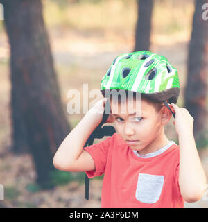 A boy wearing a helmet for cycling Stock Photo