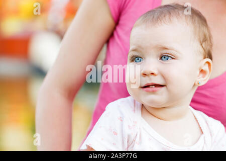 Portrait of an adorable baby girl in outside Stock Photo
