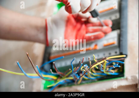 The electric wires are sticking out of the switch box. Stock Photo