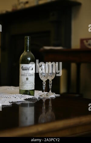 Red Wine Bottle And Two Crystal Glasses On Coffee Table Stock Photo Alamy