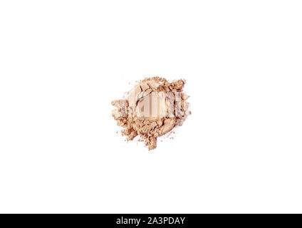 Natural matt beige colored pigment. Loose cosmetic powder. Eyeshadow pigment isolated on a white background, close-up. Stock Photo
