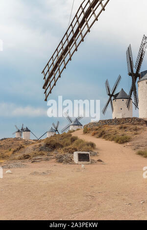 vertical view of old windmills on Calderico hill of the spanish municipality of Consuegra. these windmills are a touristic landmark in the province of Stock Photo