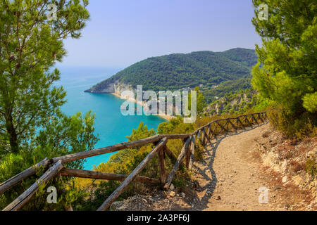 The most beautiful coasts of Italy: Zagare Bay (Apulia).The beaches offer a breathtaking view with brightly white karstic cliffs,emerald-blue sea. Stock Photo