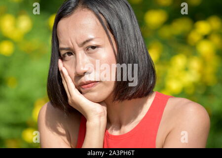 Worried Youthful Asian Person Stock Photo