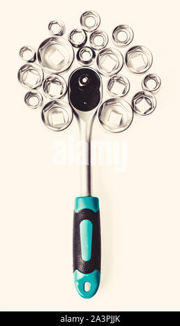 Ratchet wrench. Steel made no skid threaded handle without slipping. Universal socket set white background isolated. Crafts and repair. Knob for socket wrench nut ratchet close up. Ratchet tool. Stock Photo